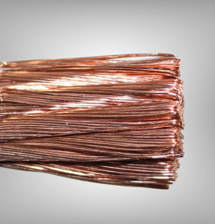 Macro of a bare Class K copper strand bundle against a grey ground
