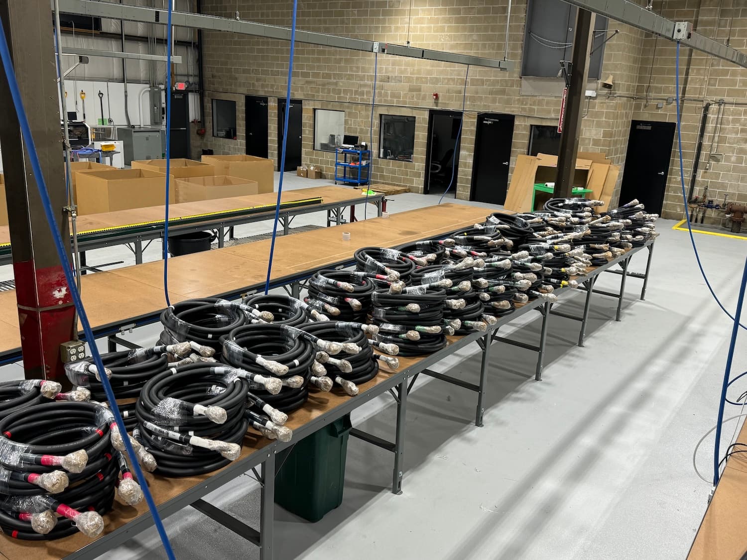 Coiled DLO leads with terminated ends stacked on Polar Wire benches