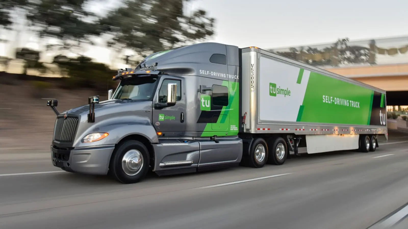 A tractor trailer at speed on a highway