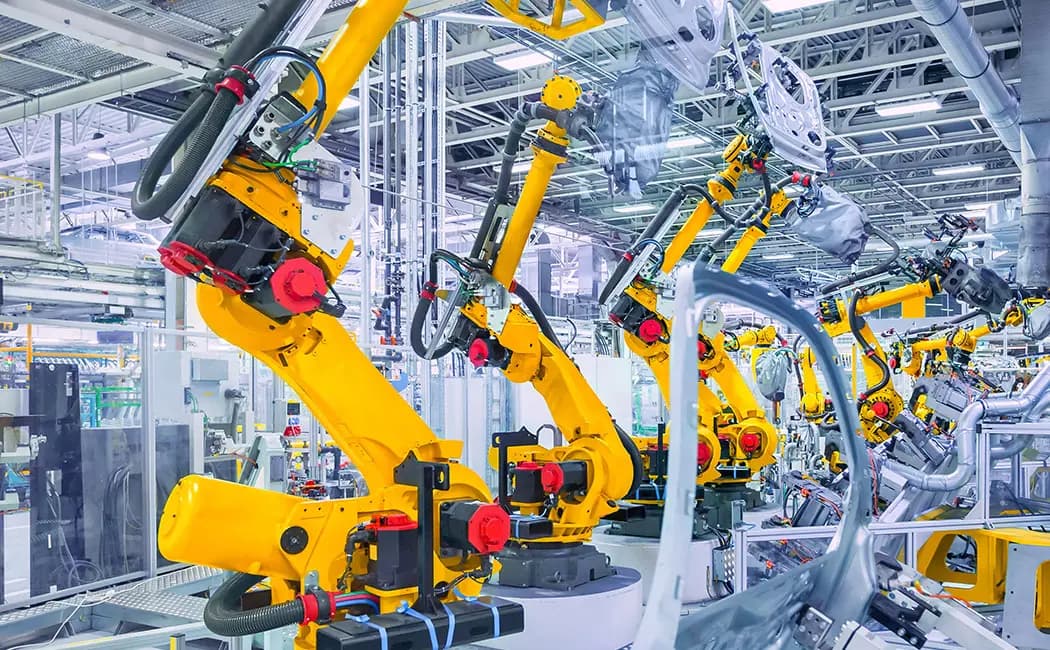 Robotic arms on an automated production line