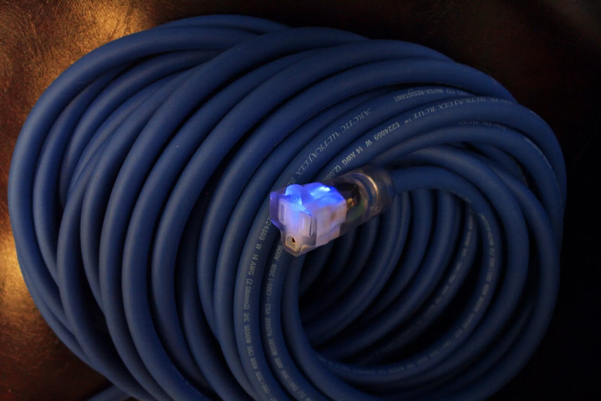 Arctic Ultraflex Blue extension cord, clear lighted molded end glowing