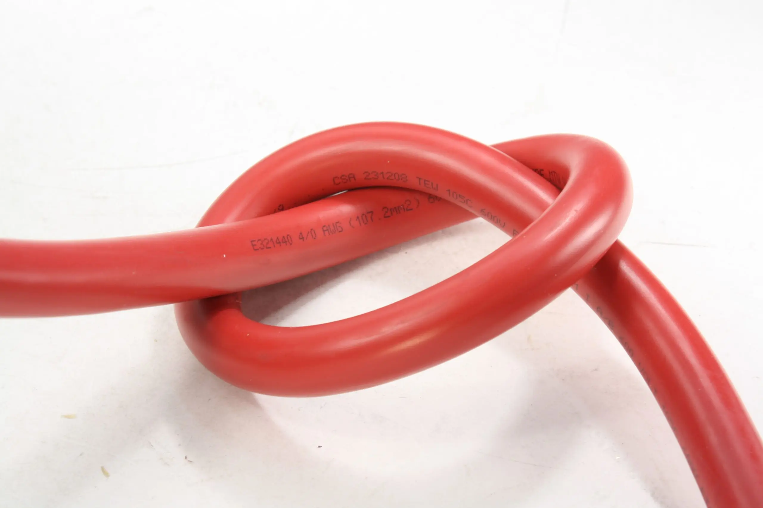 4/0 AWG red Multi-Listed Flexible Wire tied in a knot, showing extra-flexible PVC