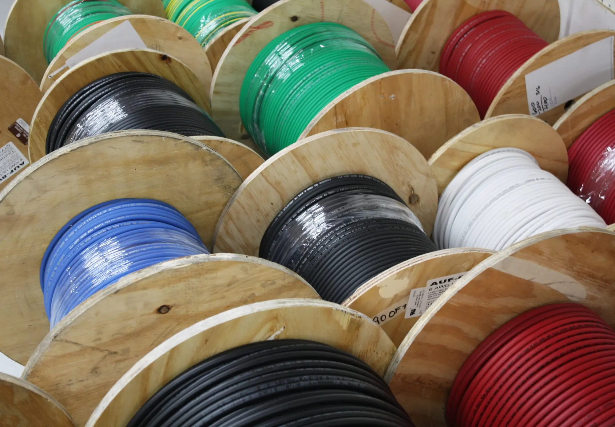 Wooden reels of Polar Wire in multiple jacket colors on the factory floor